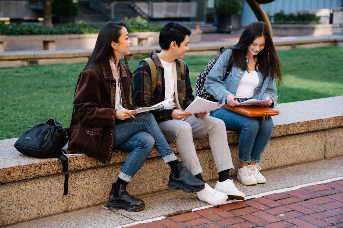 Free Students Sitting Outside Studying  Stock Photo